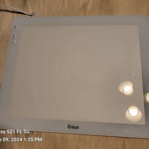 Cricut Bright Pad for weeding Vinyl.